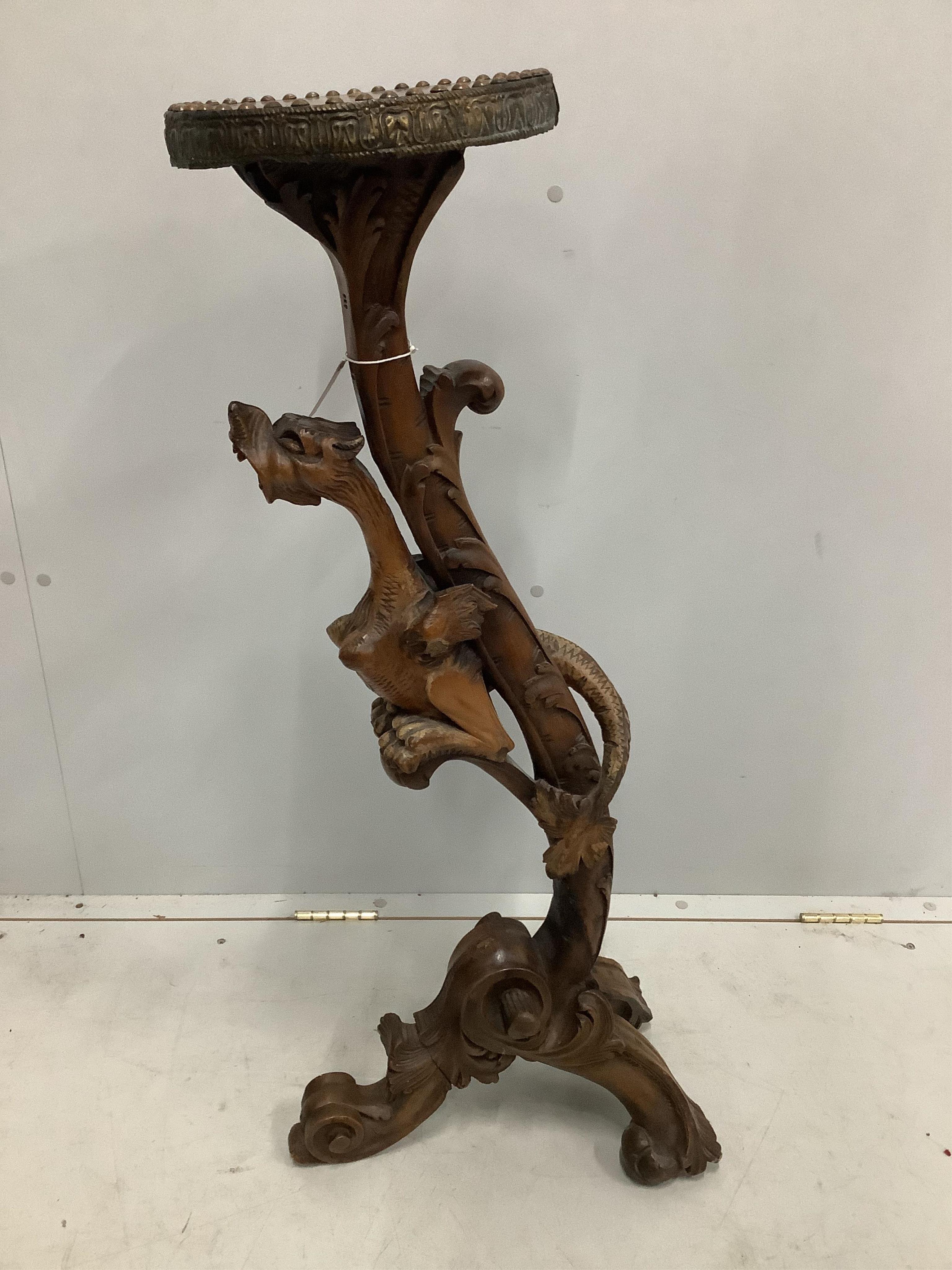 An Italian pine and carved walnut torchere with dragon column, height 100cm. Condition - fair